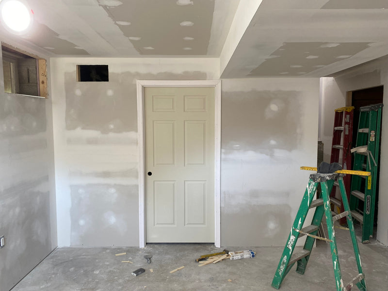 Framing out, installing drywall, and doors in unfinished basement in Hampstead Maryland