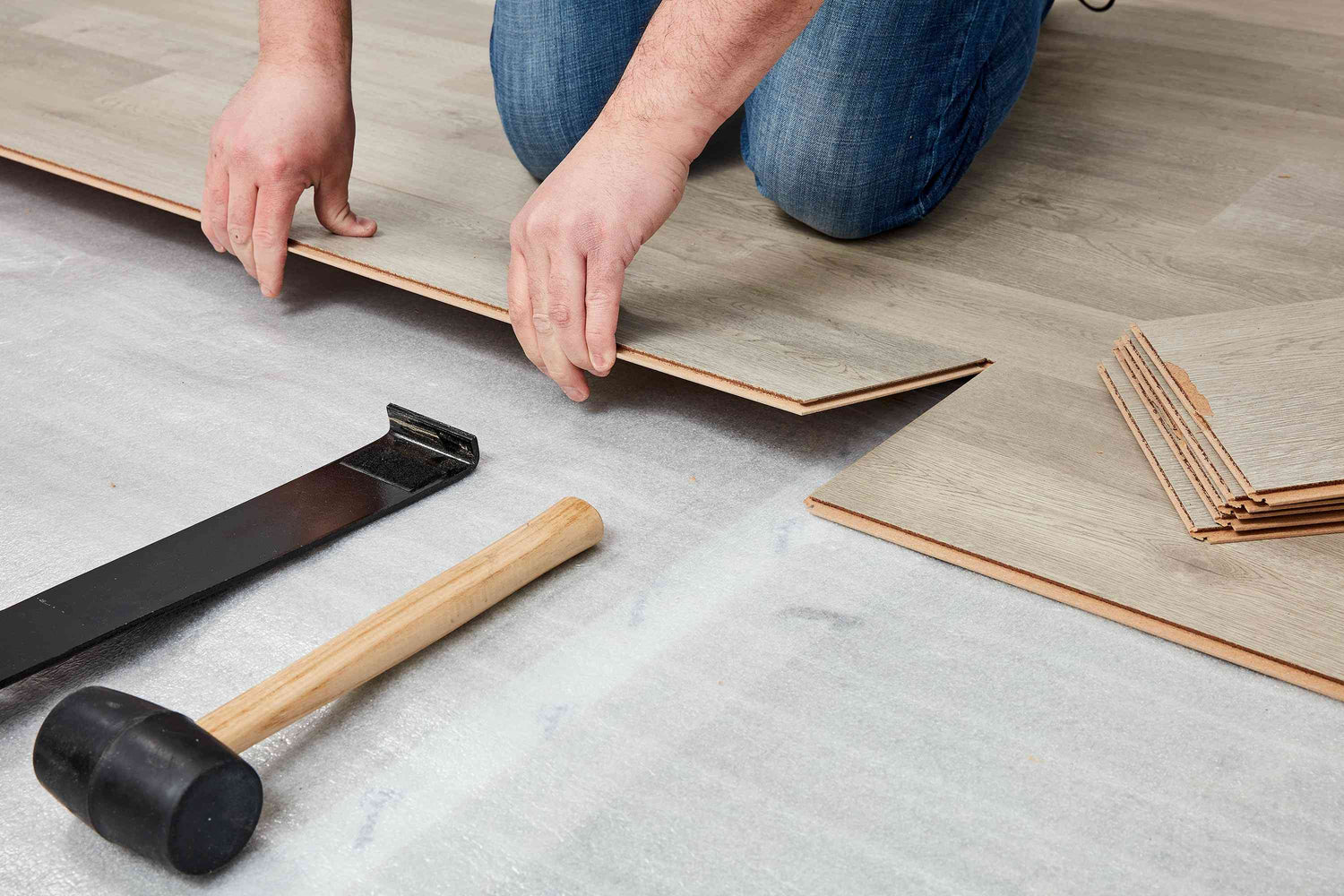 Luxury vinyl plank flooring installation and tile work in a living room in Eldersburg, MD.