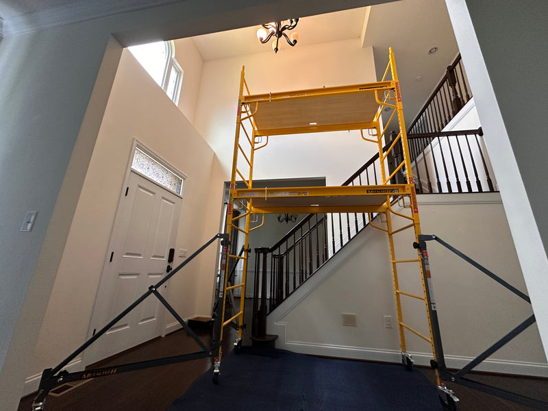 Scaffolding set up to install new chandelier in foyer in Pasadena Maryland